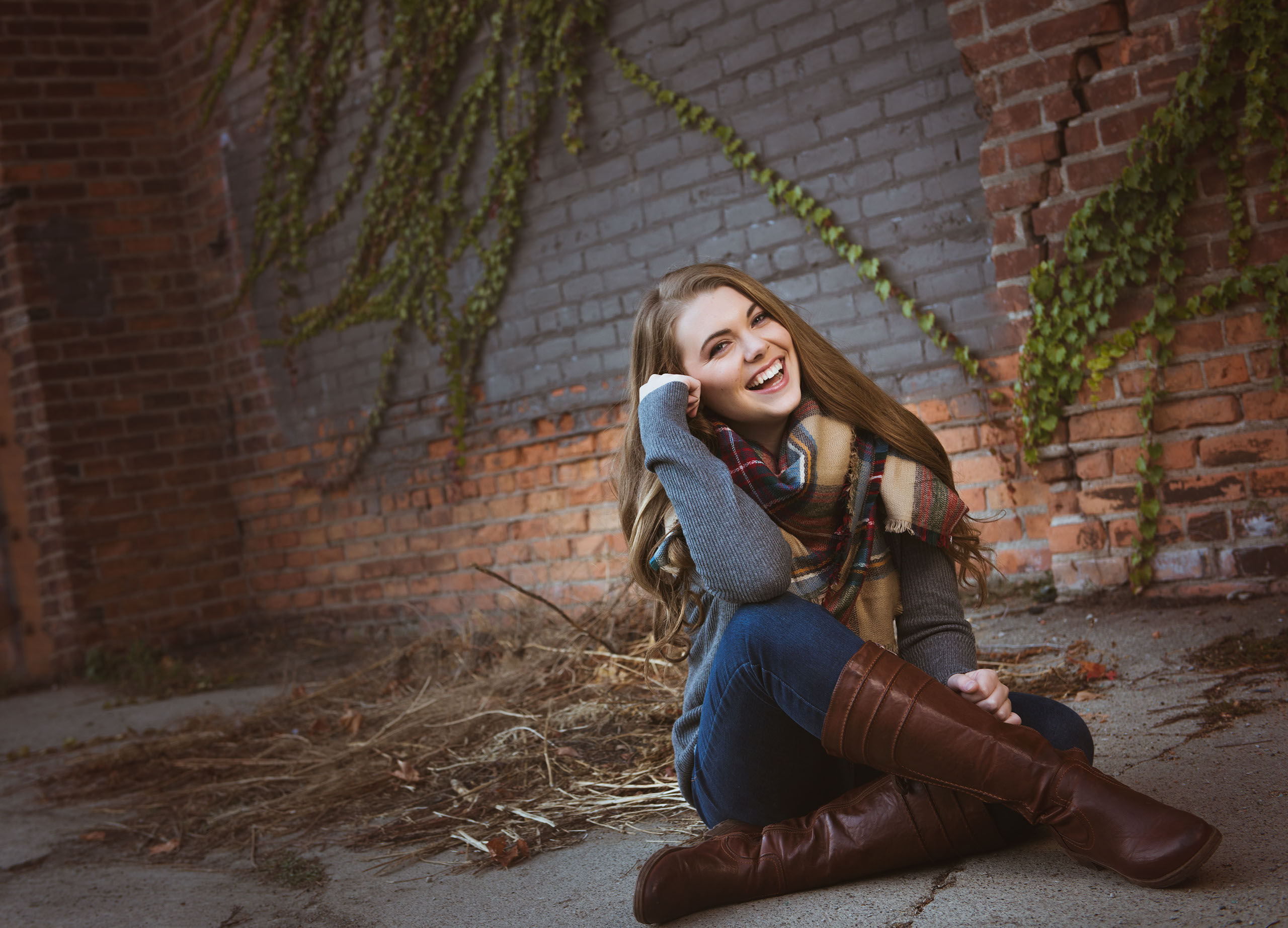 A Senior photo of Anthony Wayne High School student, Kelsey, posing with an Elephant at the Toledo Lucas County Fair.