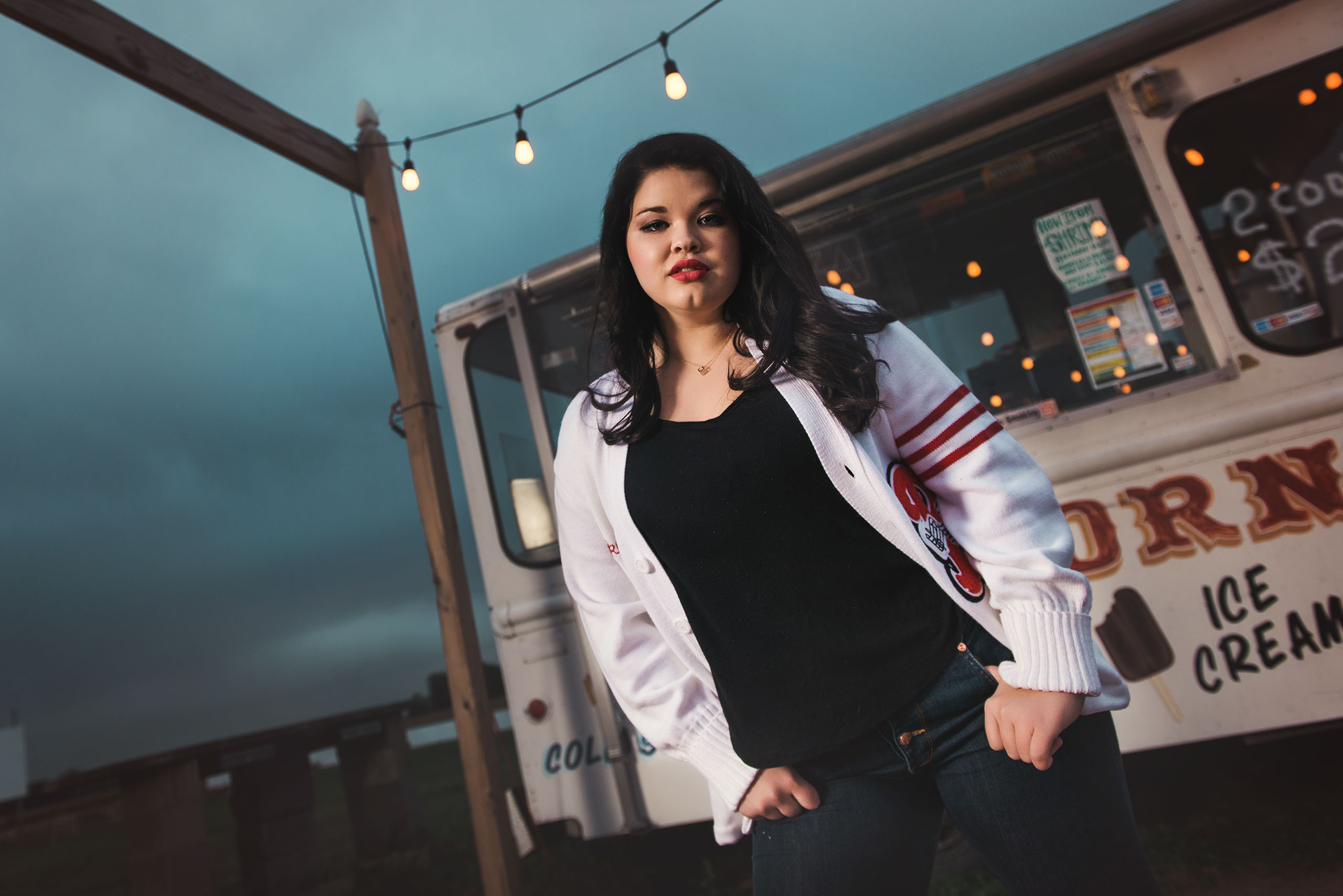 A Senior photo of Anthony Wayne High School student, Kelsey, posing with an Elephant at the Toledo Lucas County Fair.