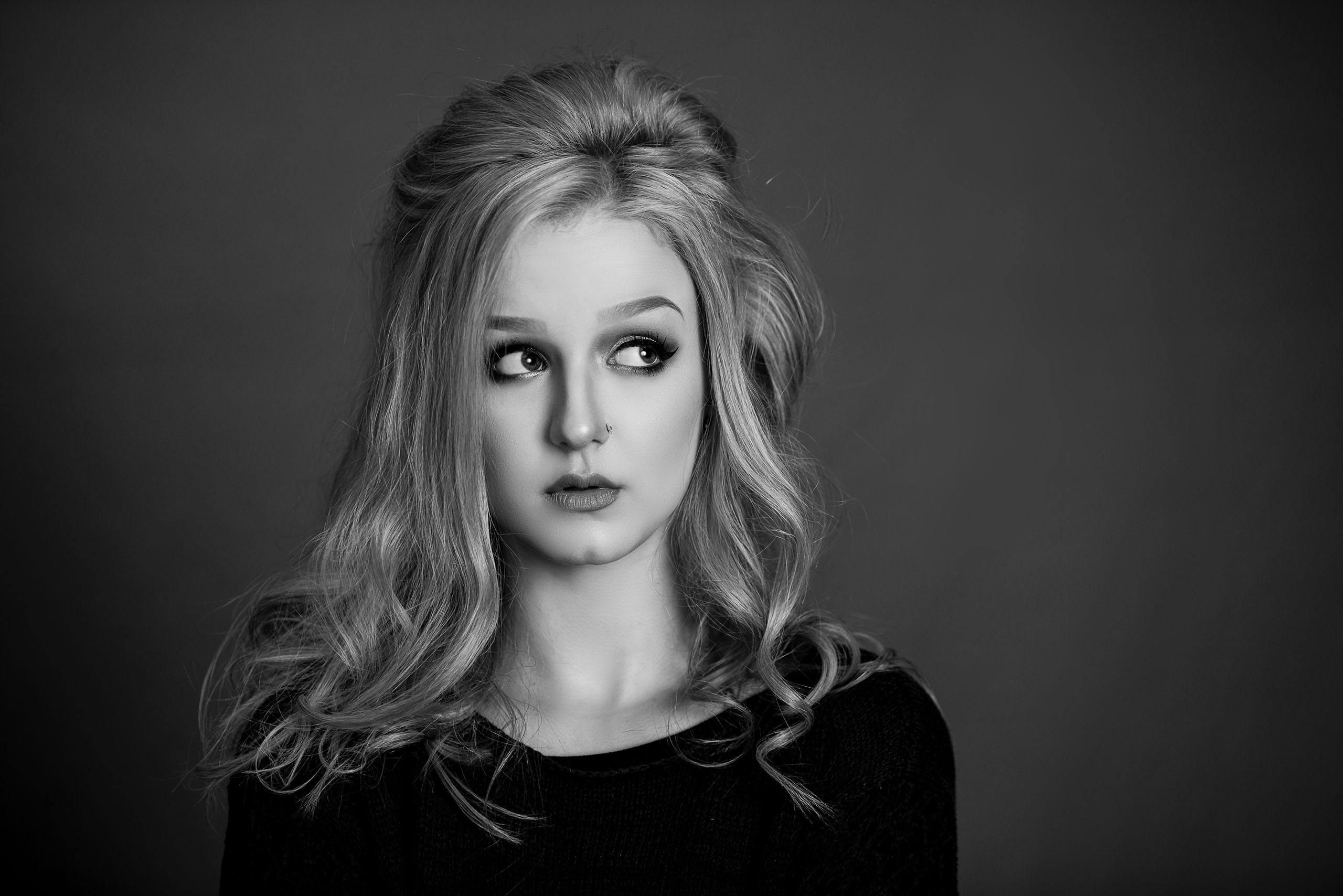 A Senior photo of Anthony Wayne High School student, Kelsey, posing with an Elephant at the Toledo Lucas County Fair.