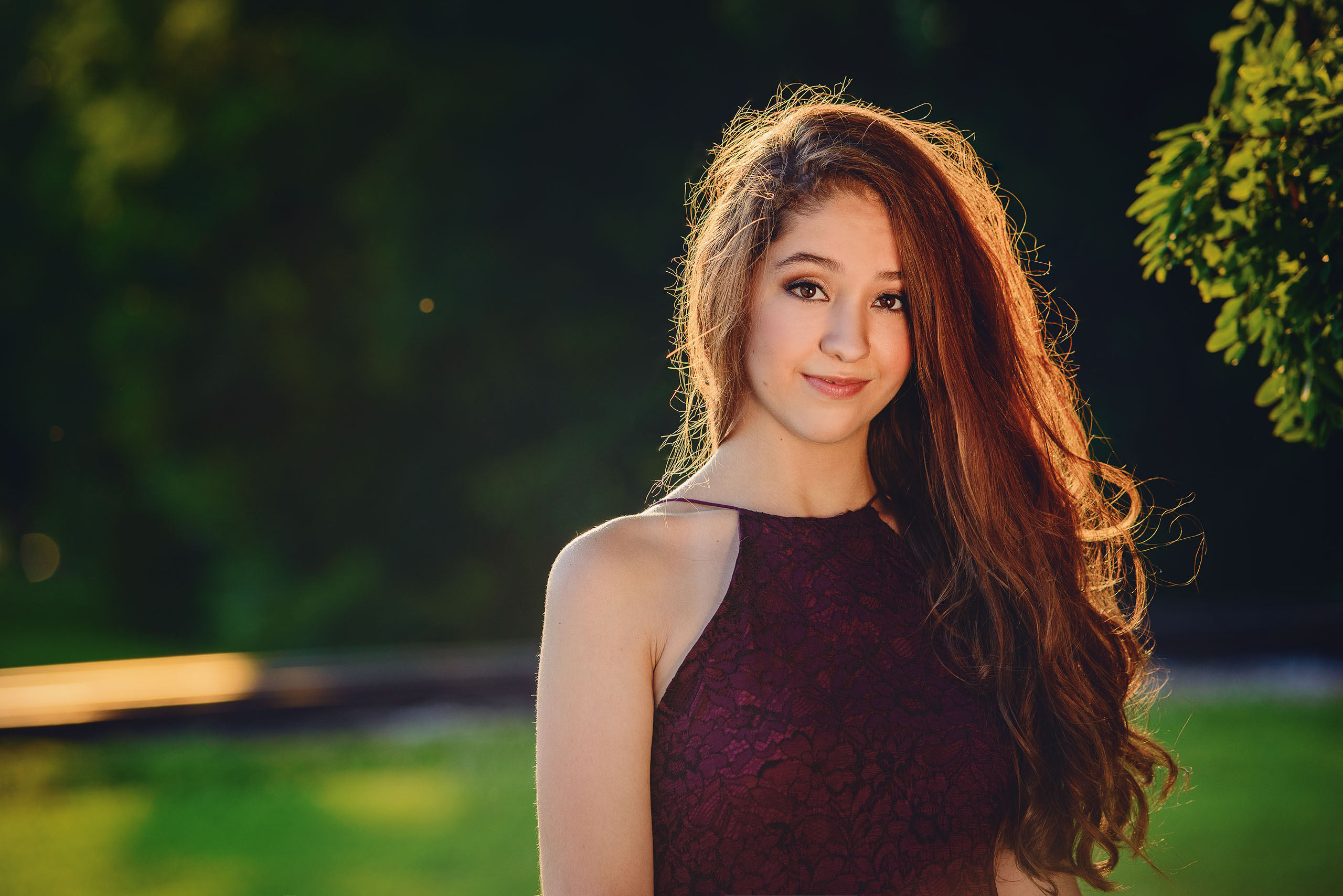 A Senior photo of Anthony Wayne High School student, Kelsey, posing with an Elephant at the Toledo Lucas County Fair.