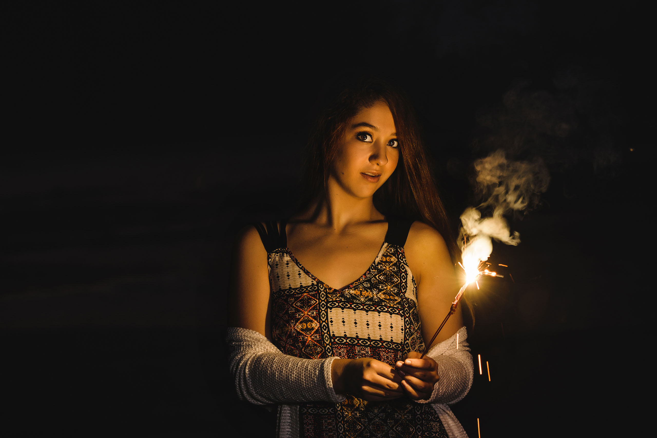 A Senior photo of Anthony Wayne High School student, Kelsey, posing with an Elephant at the Toledo Lucas County Fair.