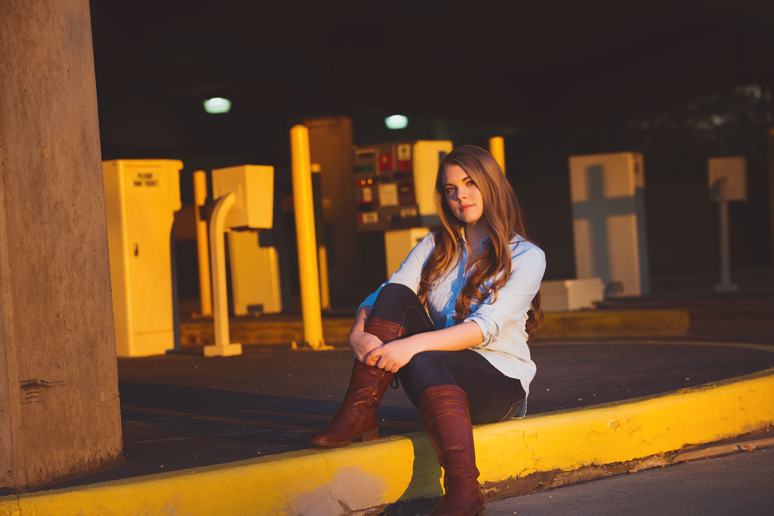 A Senior photo of Anthony Wayne High School student, Kelsey, posing with an Elephant at the Toledo Lucas County Fair.